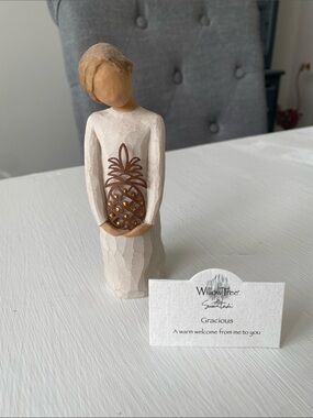 Willow Tree 'Gracious' Figurine holding a Pineapple with Gold Accents